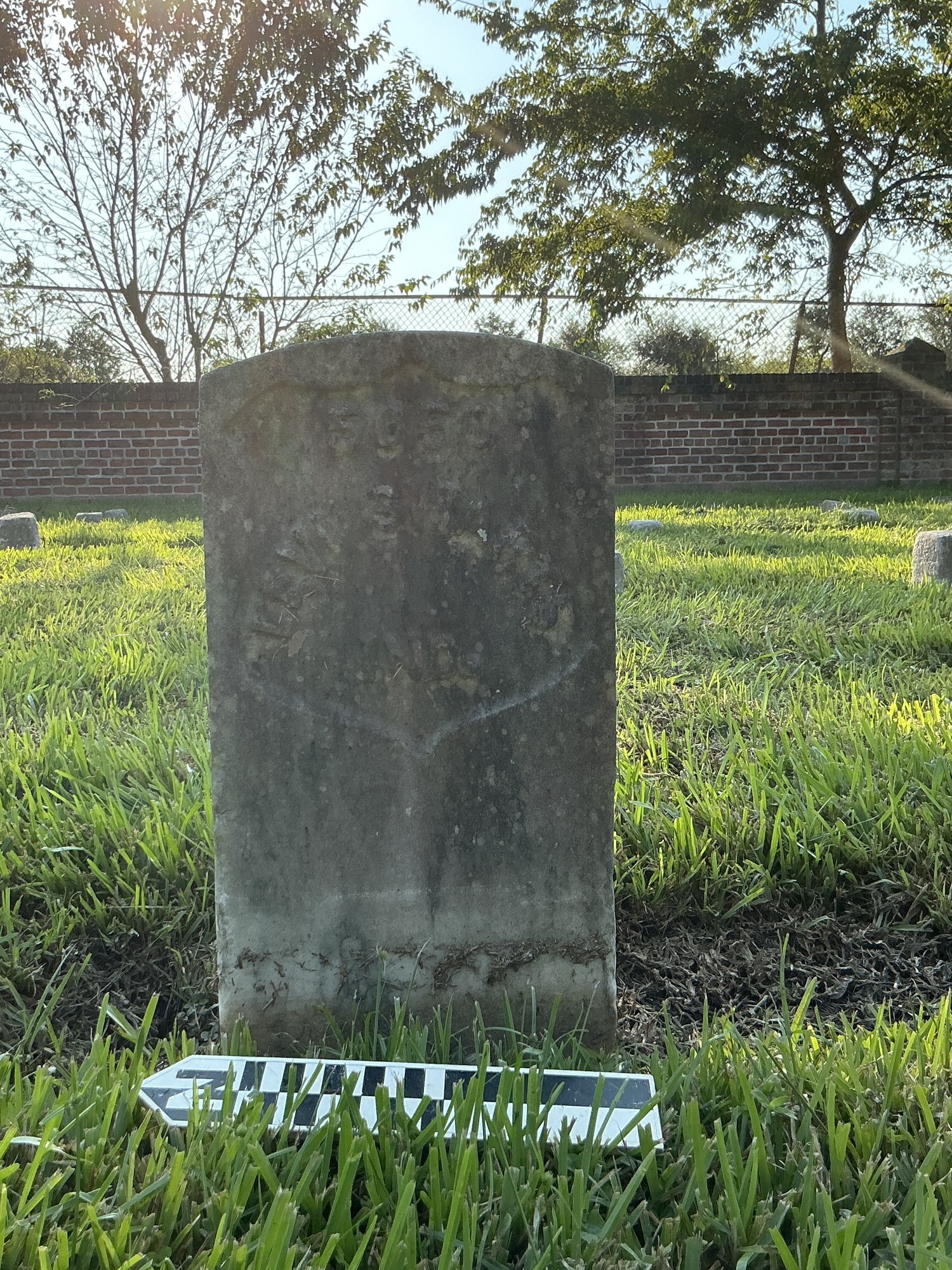Extra image of historic upright marble headstone with recessed shield face.