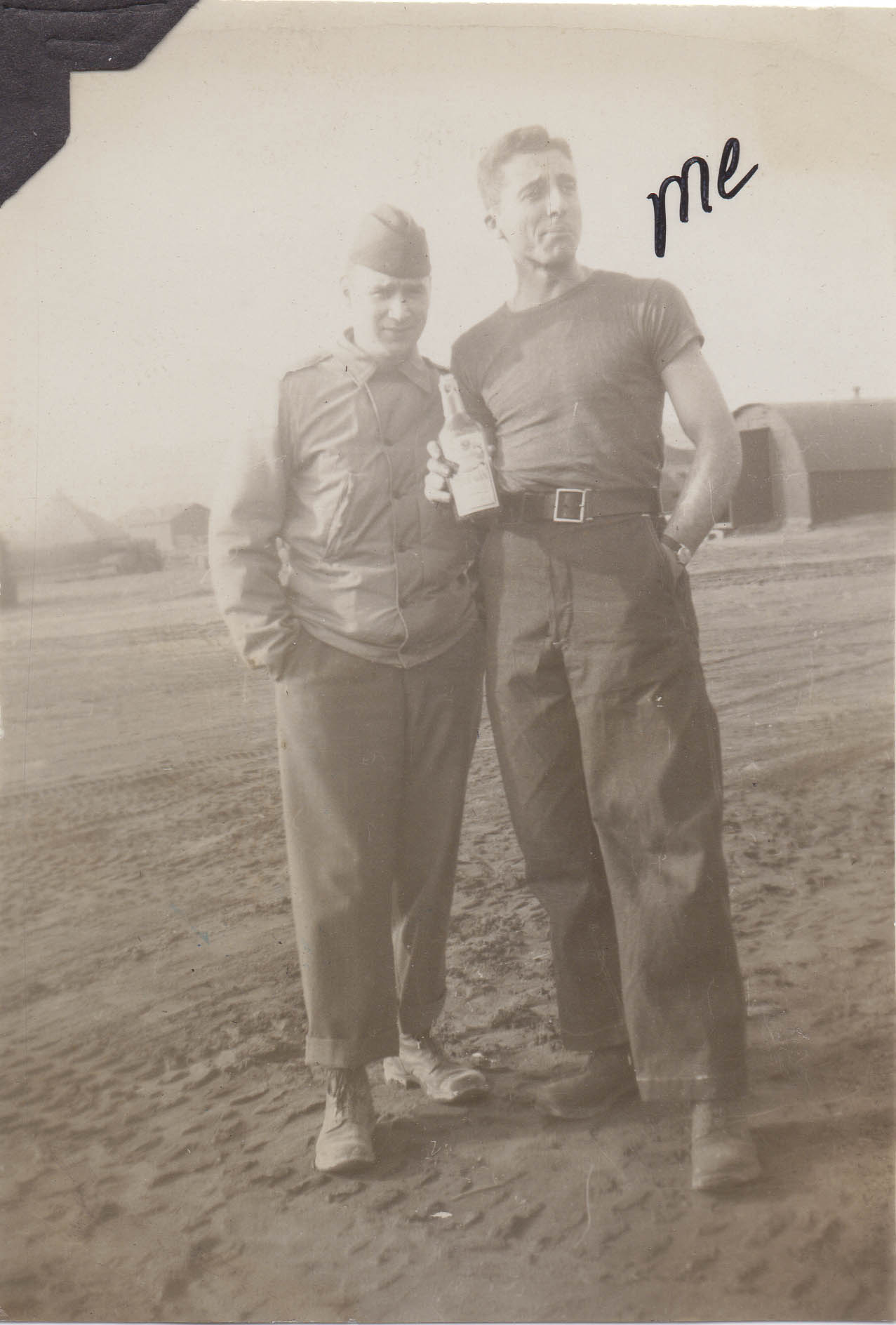 Two men gather around a liquor bottle.  Handwritten label Me is next to the man on the right