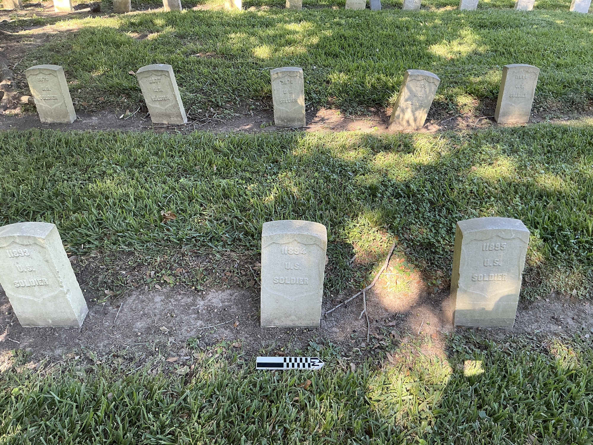 Extra image of historic upright marble headstone with recessed shield face.