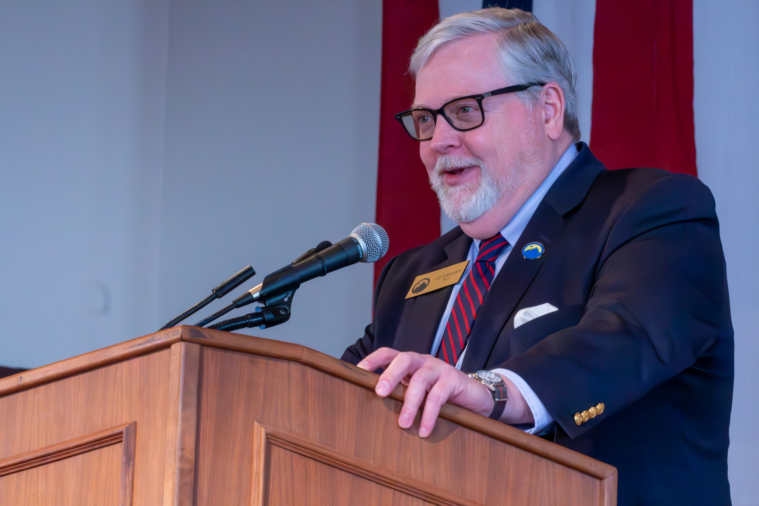 Americus, Georgia Mayor Lee Kinnamon speaking at podium.