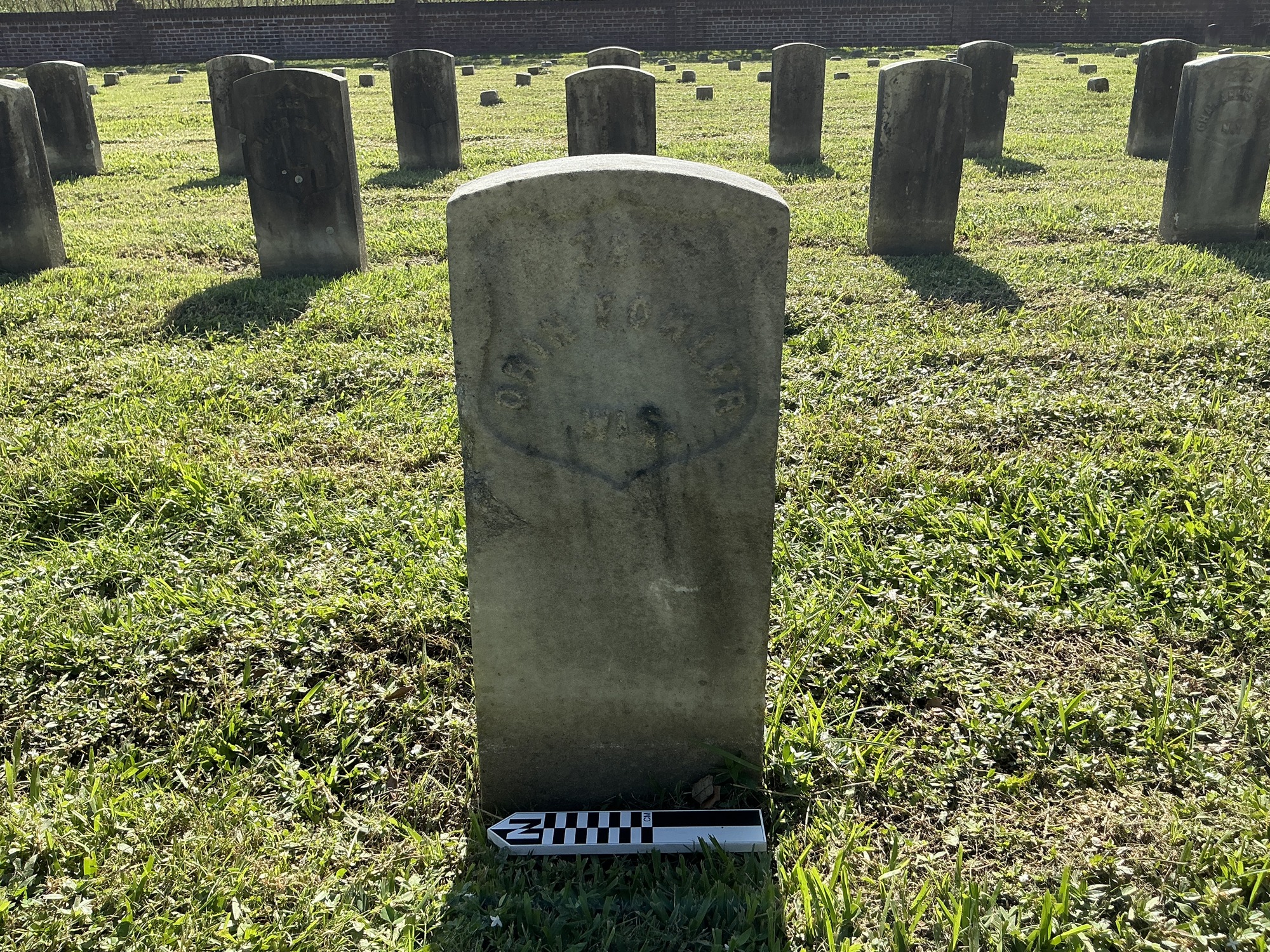 Extra image of historic upright marble headstone with recessed shield face.
