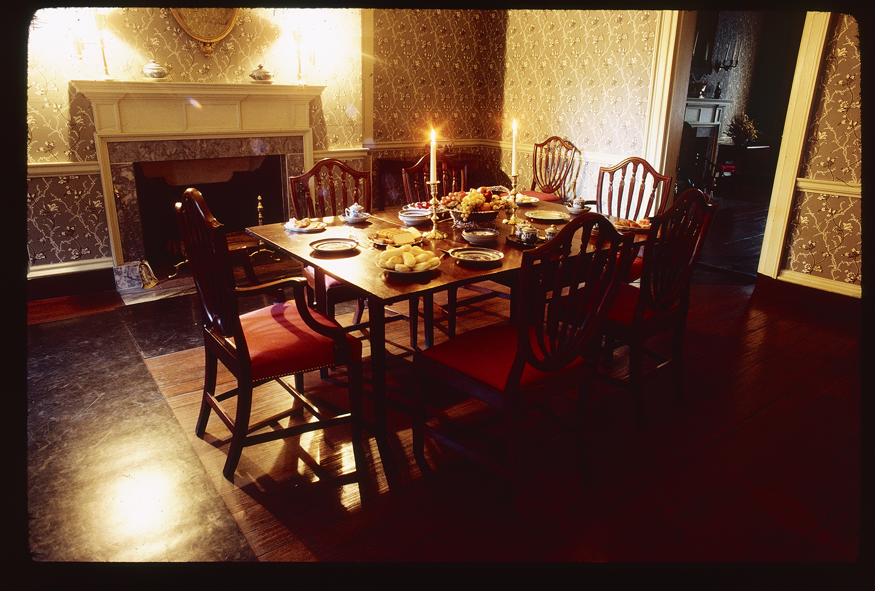 Bishop White House. Interior. 1st floor, dining room. Looking southeast at dining table and towards corner.