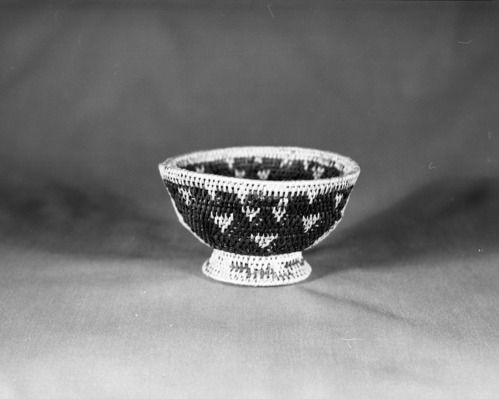 Private Collection. Object: Miwok basket. Dimensions: 5 1/4 x 3". Materials: Bracken fern root and split bull pine shoots. Technology: Single rod, interlocking stitch, fag ends trimmed on work face, and moving ends trimmed on interior. Collection History: Acquired from Jake Barendregt in 1982. (Possibly from Tuolumne County). Photographed by Michael Dixon. Catalogued by Craig Bates and Barbara Beroza. Yosemite Collections, National Park Service.