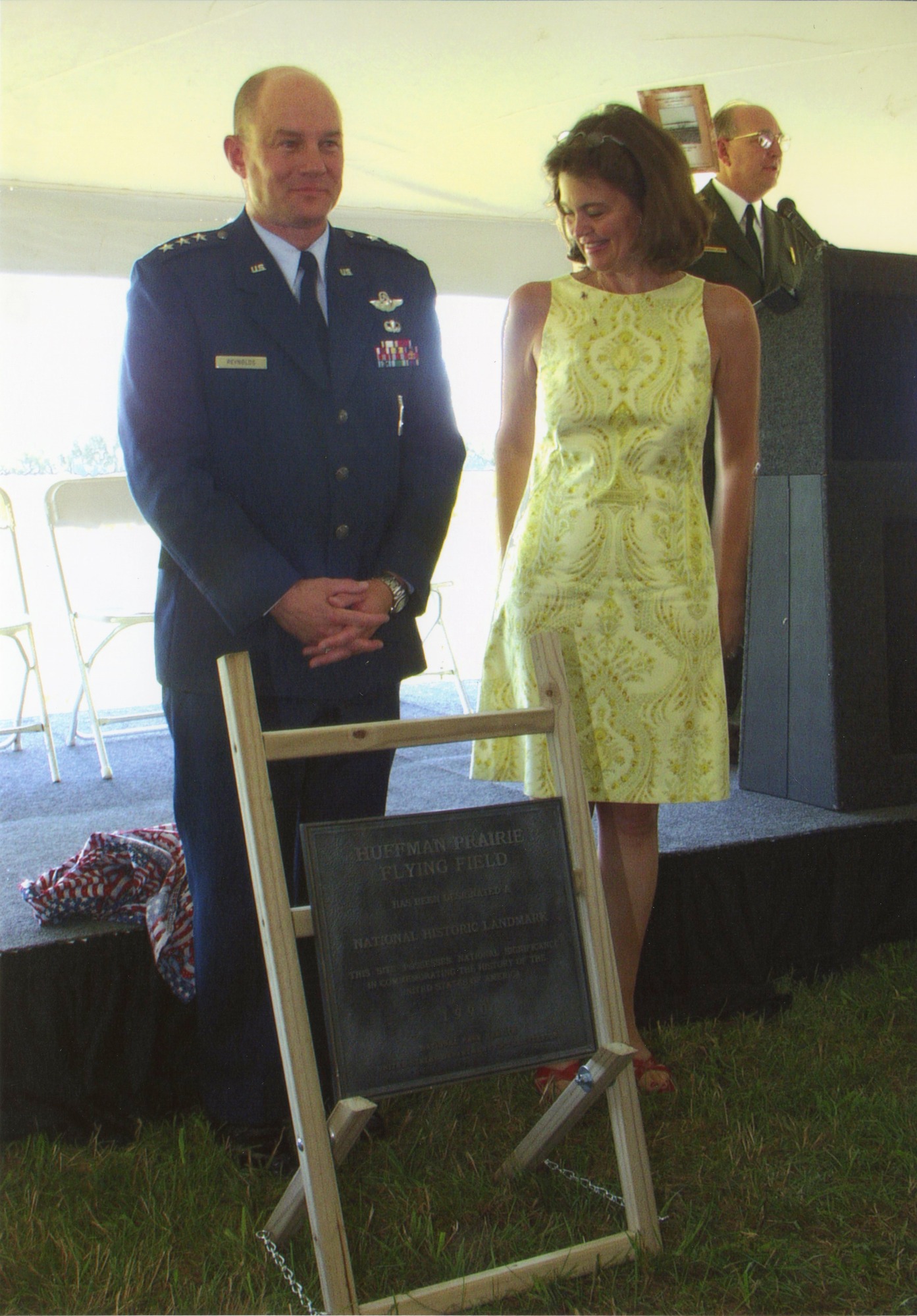 Two people standing with plaque
