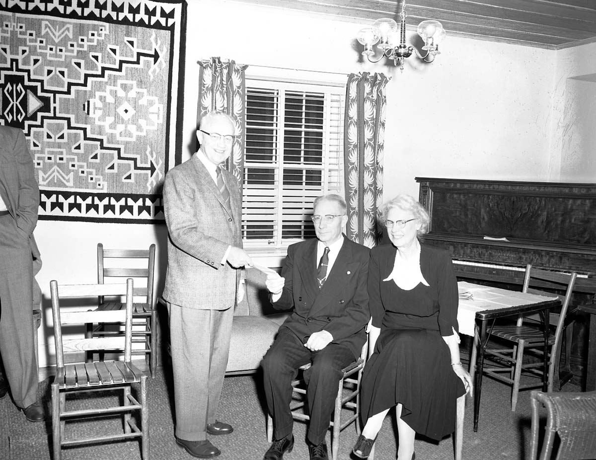 Superintendent Franke presenting going away gift and 20 year service award pin to Ken Culmers, at the ranger dormitory.