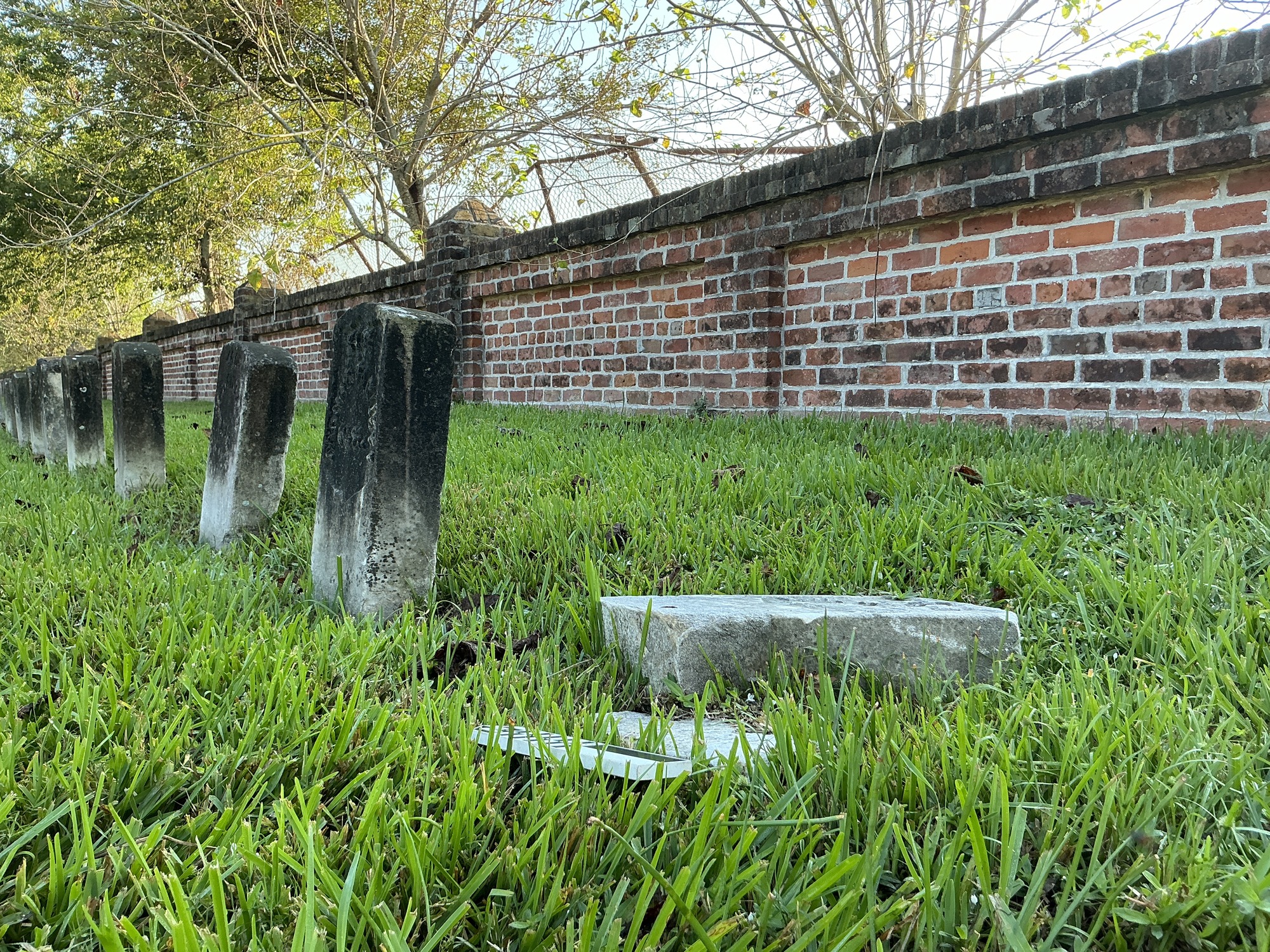 Extra image of historic upright marble headstone with recessed shield face.