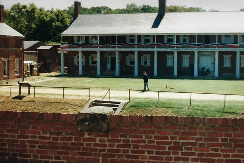 Image of the Officer's Quarters with visitors walking in front