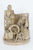 a sculpture of a man and woman conversing while the woman is working at a spinning wheel and the man is standing behind a chair