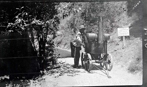 Narrows Trail construction with worker operating the oil heater used in spraying on the bitumuls 50.