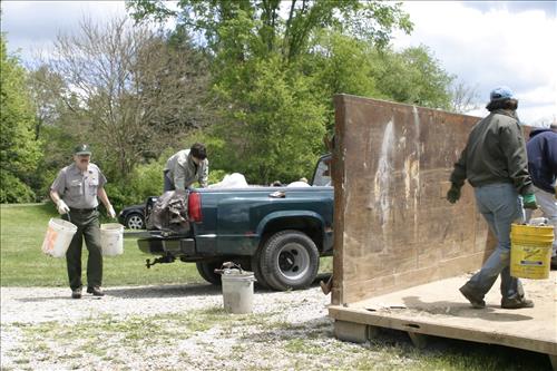 RiverDay trash clean up staff and volunteers at dumpster