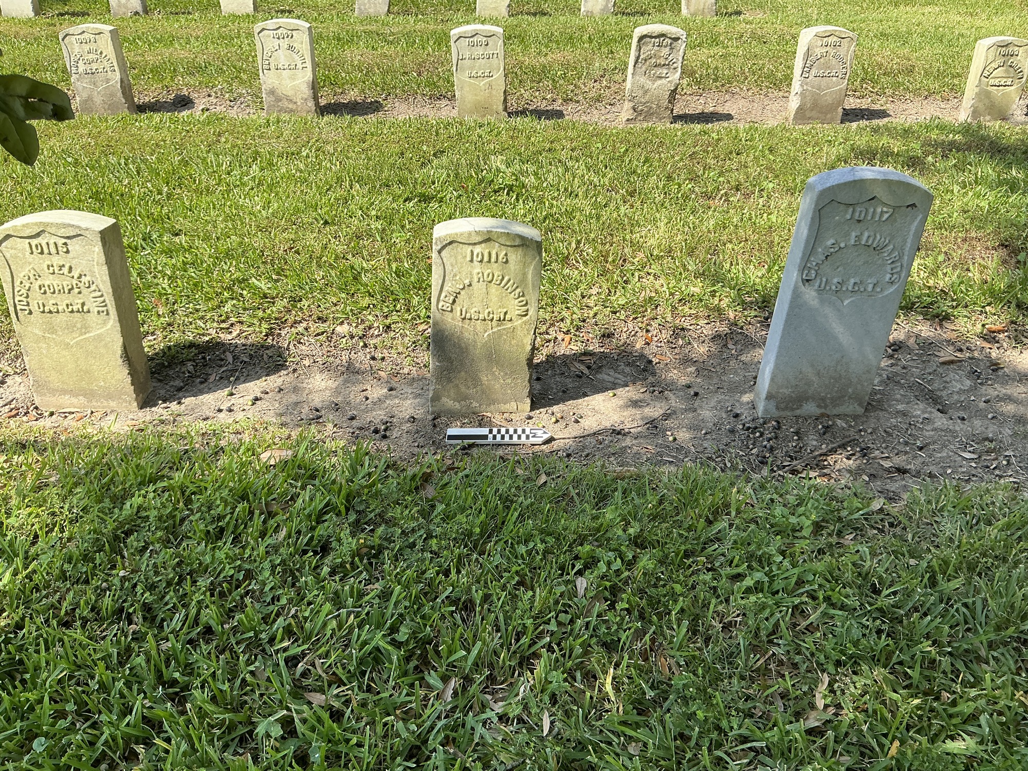 Extra image of historic upright marble headstone with recessed shield face.