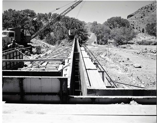 Wall forms in place for east wall of basement, bucket of cement ready for pouring at Mission 66 Visitor Center and Museum.