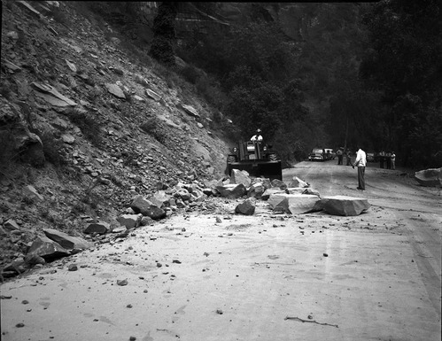 Rock slide near Temple of Sinawava rocks being removed from road with tractor and front end loader.