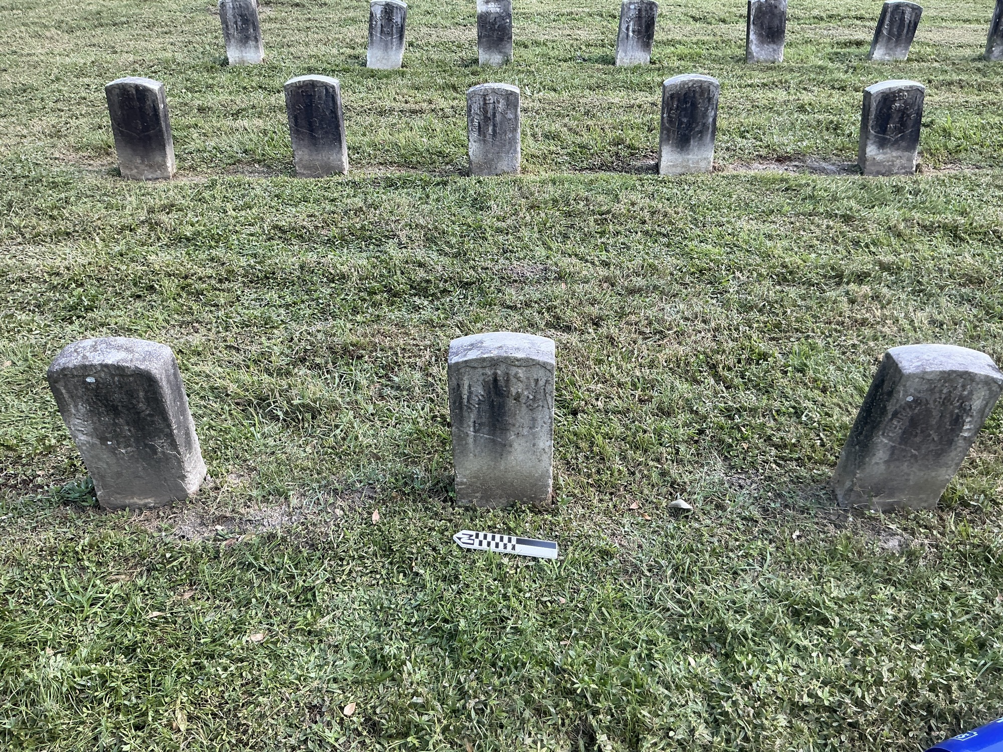 Extra image of historic upright marble headstone with recessed shield face.