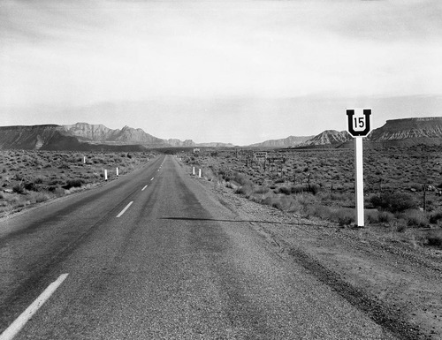 The Grandma's signs and other signs on Utah State Route 15 (now State Route 9). Grandma's signs were black on yellow and at almost every turn from Virgin, Utah to Zion National Park. Photos were taken to documentation for the proposed clean up project to remove the undesirable signs and debris. This view north from below the town of Virgin, Utah. West Temple in the distance on the right.