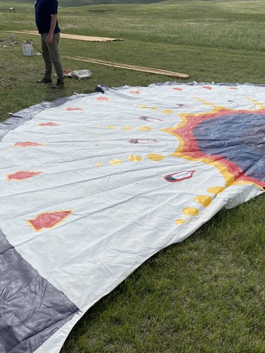 it is a close up of the painted tipi canvas
