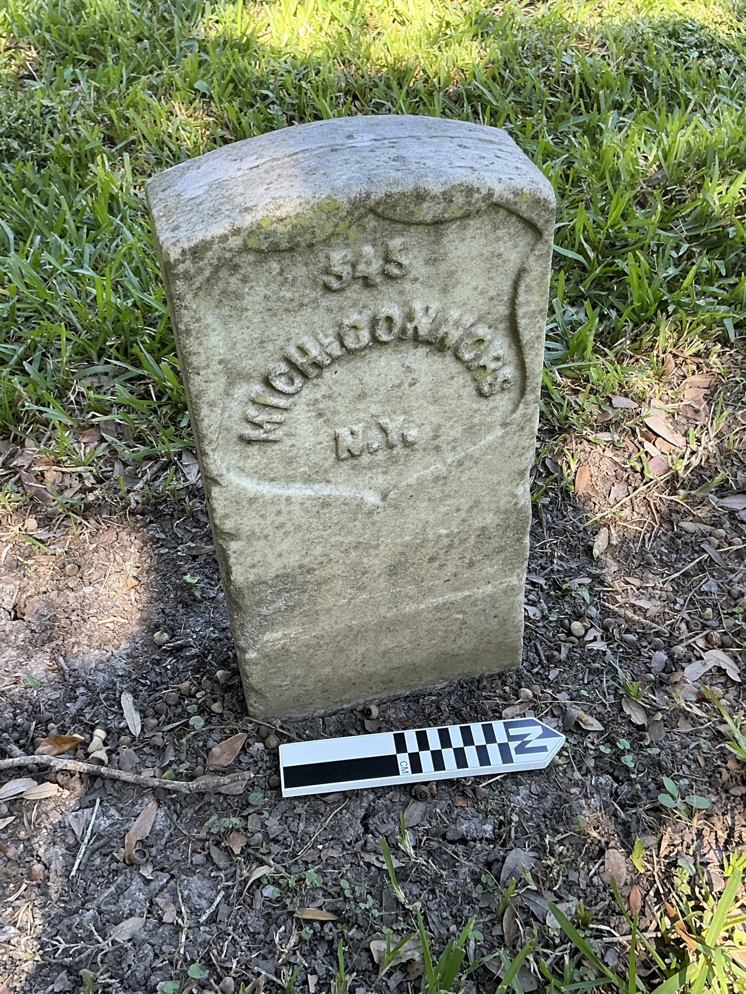 Extra image of historic upright marble headstone with recessed shield face.