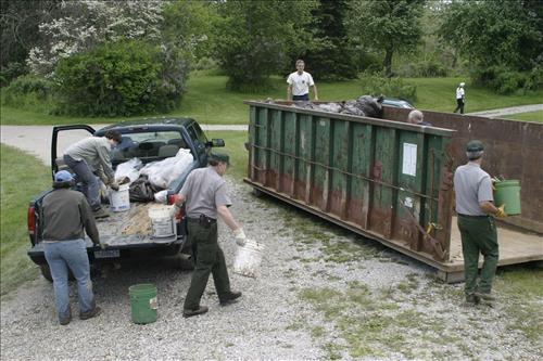 RiverDay trash clean up staff and volunteers at dumpster