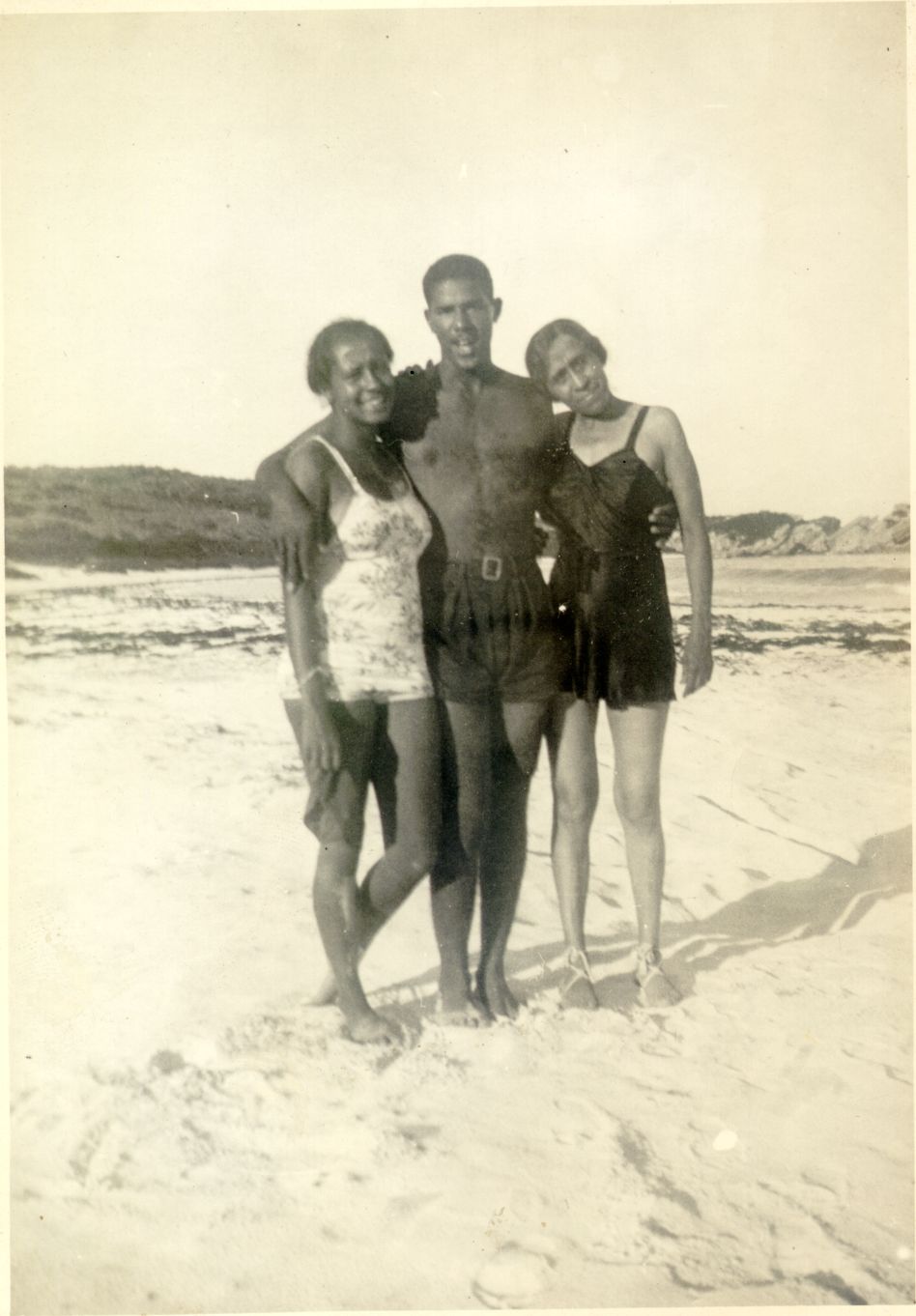Maggie Laura Walker with her aunt, Mattie Frazier Wiggins, and a man on the beach in Bermuda.