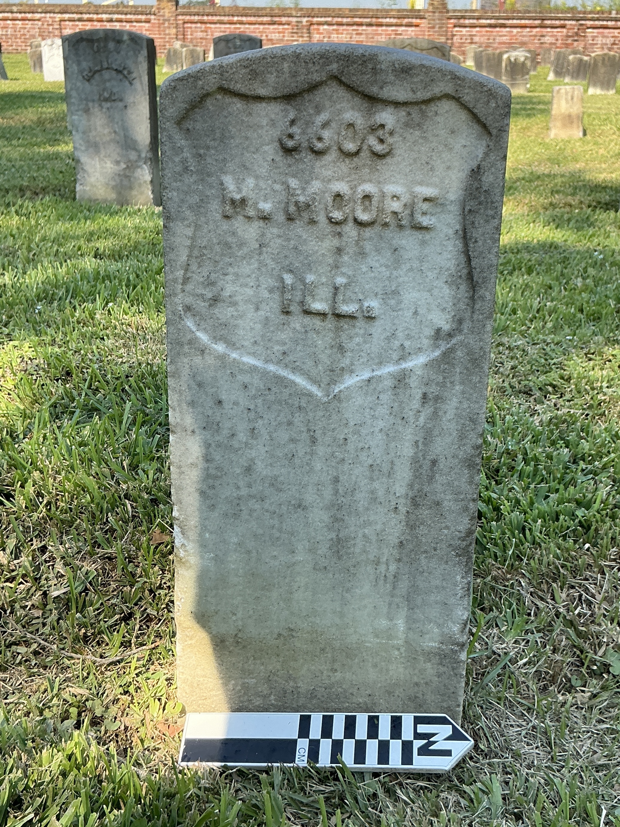 Extra image of historic upright marble headstone with recessed shield face.