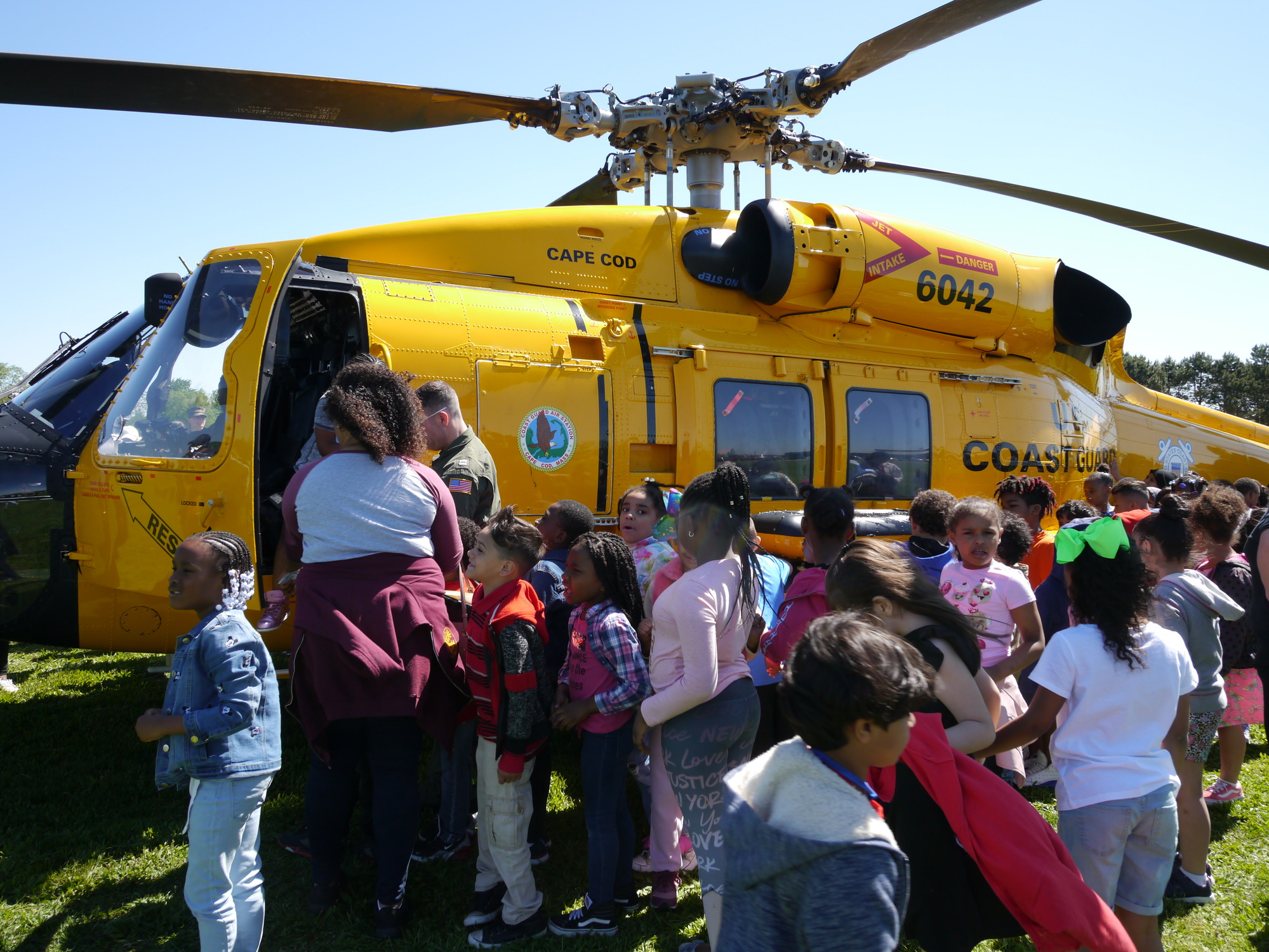 Visitors boarding a Navy helicopter at Miller Field