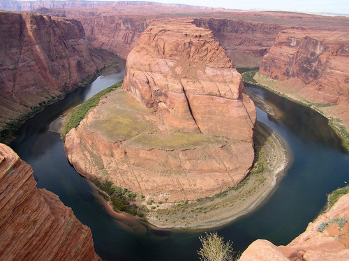 Photograph of Horseshoe Bend, a dramatic entrenched meander carved into tall cliffs by the Colorado River within Glen Canyon National Recreation Area.