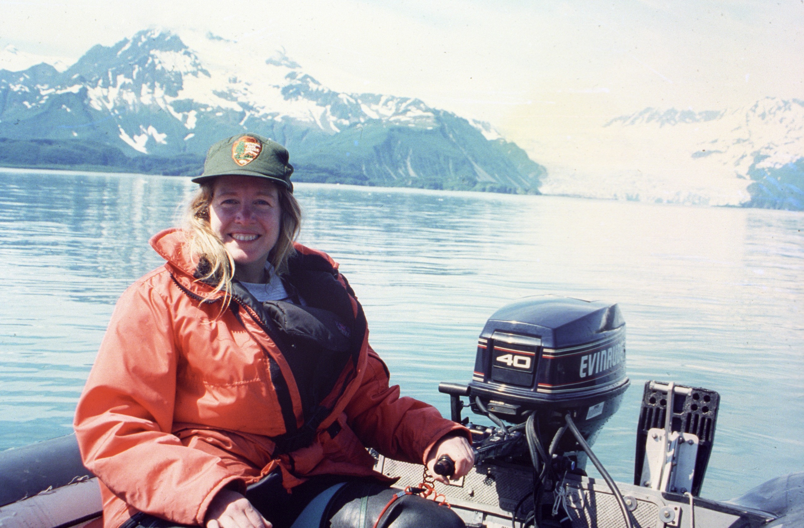 Chief of Interpretation Maria Gillett operates a small boat in Aialik Bay