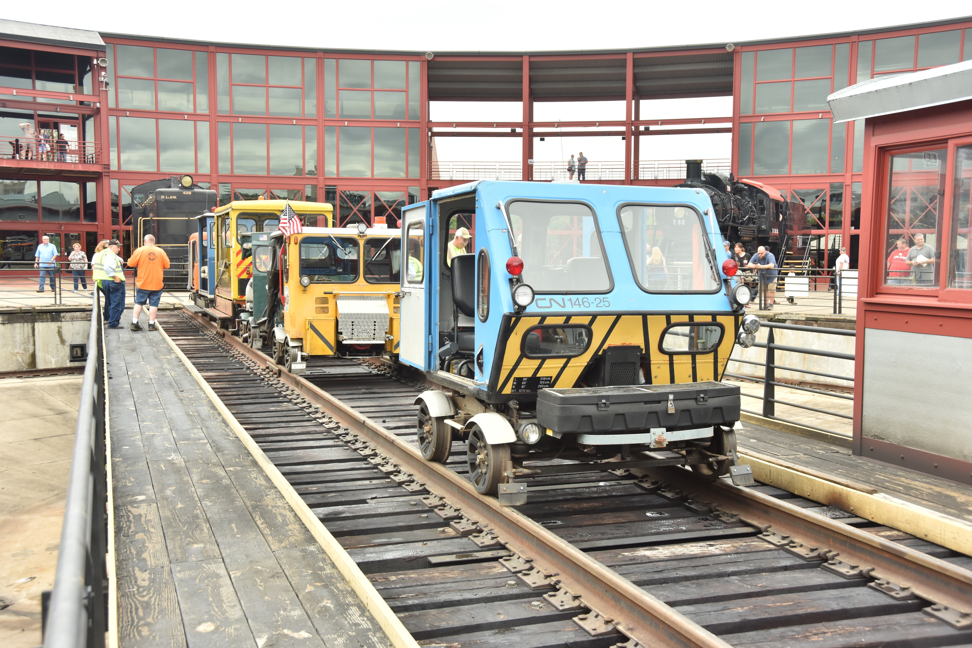 Four trackcar speeders on a turntable for a demonstration