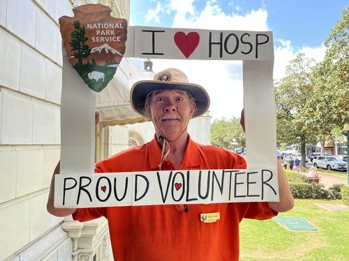 A volunteer poses at Hot Spring National Park's Fordyce Visitor Center during National Volunteer Week.