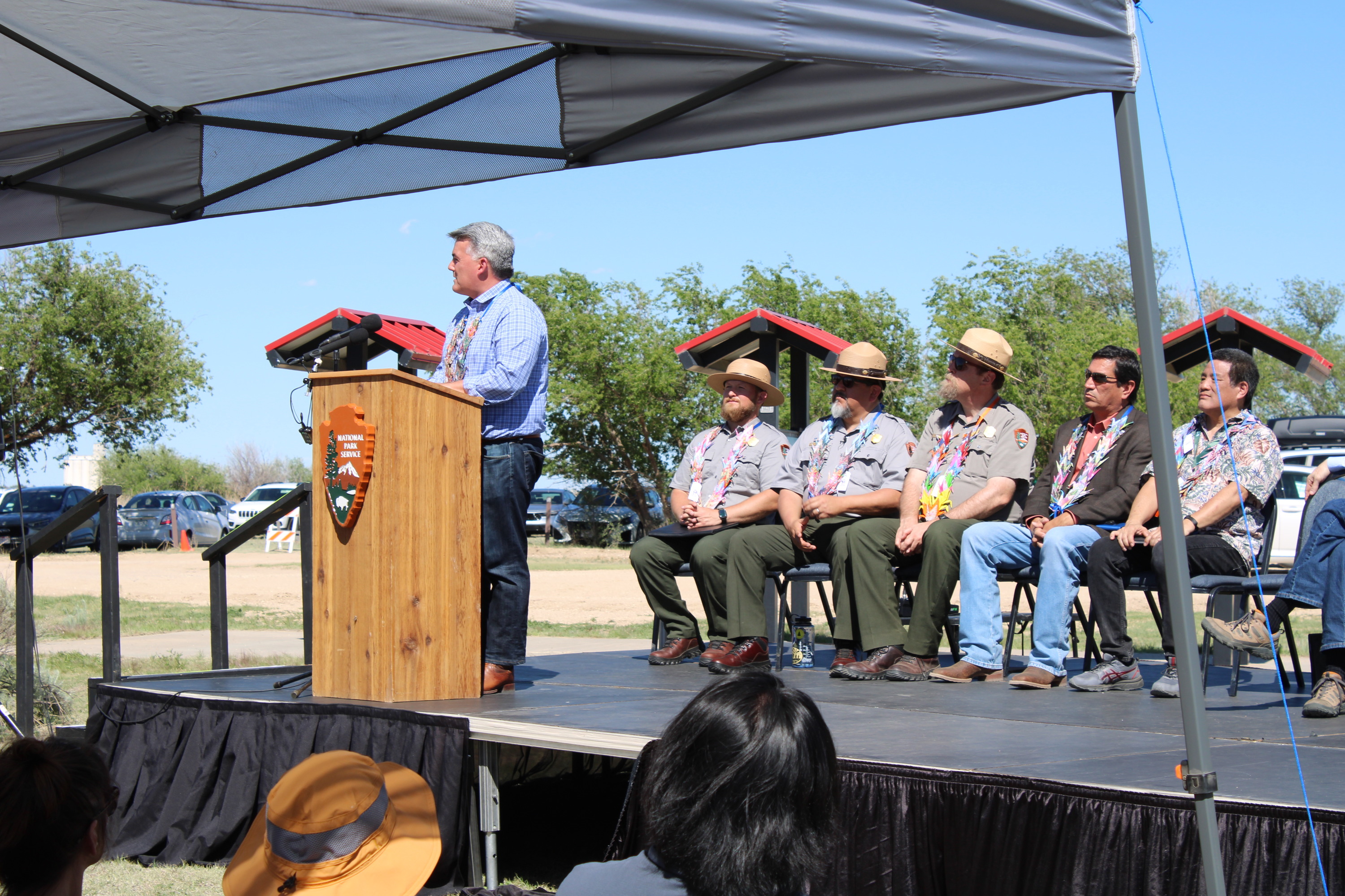 A man standing behind a podium on stage.