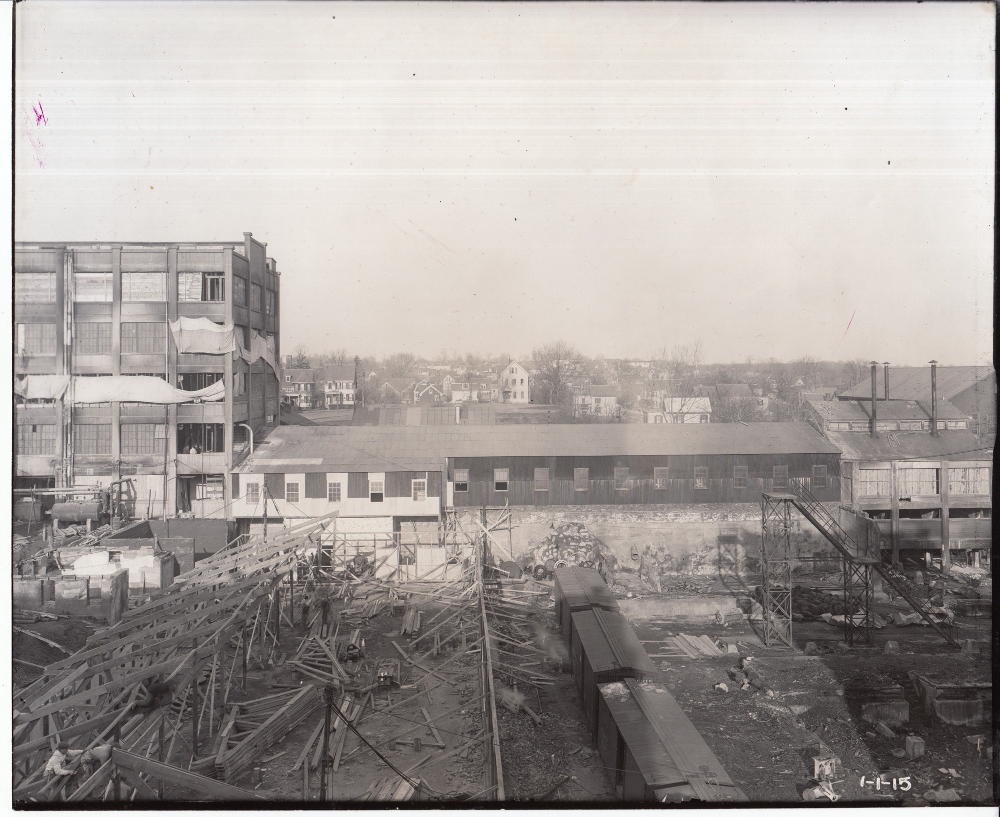 Toward Alden Street from Building 25, boxcars in foreground.