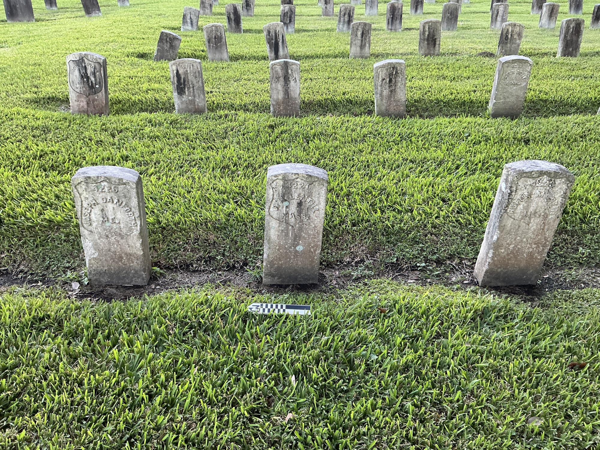 Extra image of historic upright marble headstone with recessed shield face.