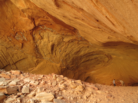 Photograph of Bechan Cave, Glen Canyon National Recreation Area. The recessed alcove is 53 m (170 ft) deep, 32 m (100 ft) wide, and up to 9 m (30 ft) high. 