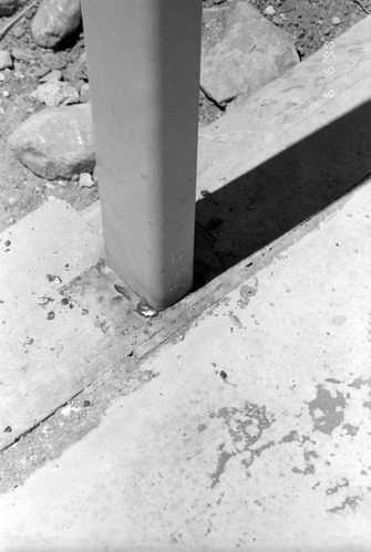 Beam in cement during construction of headquarters addition.