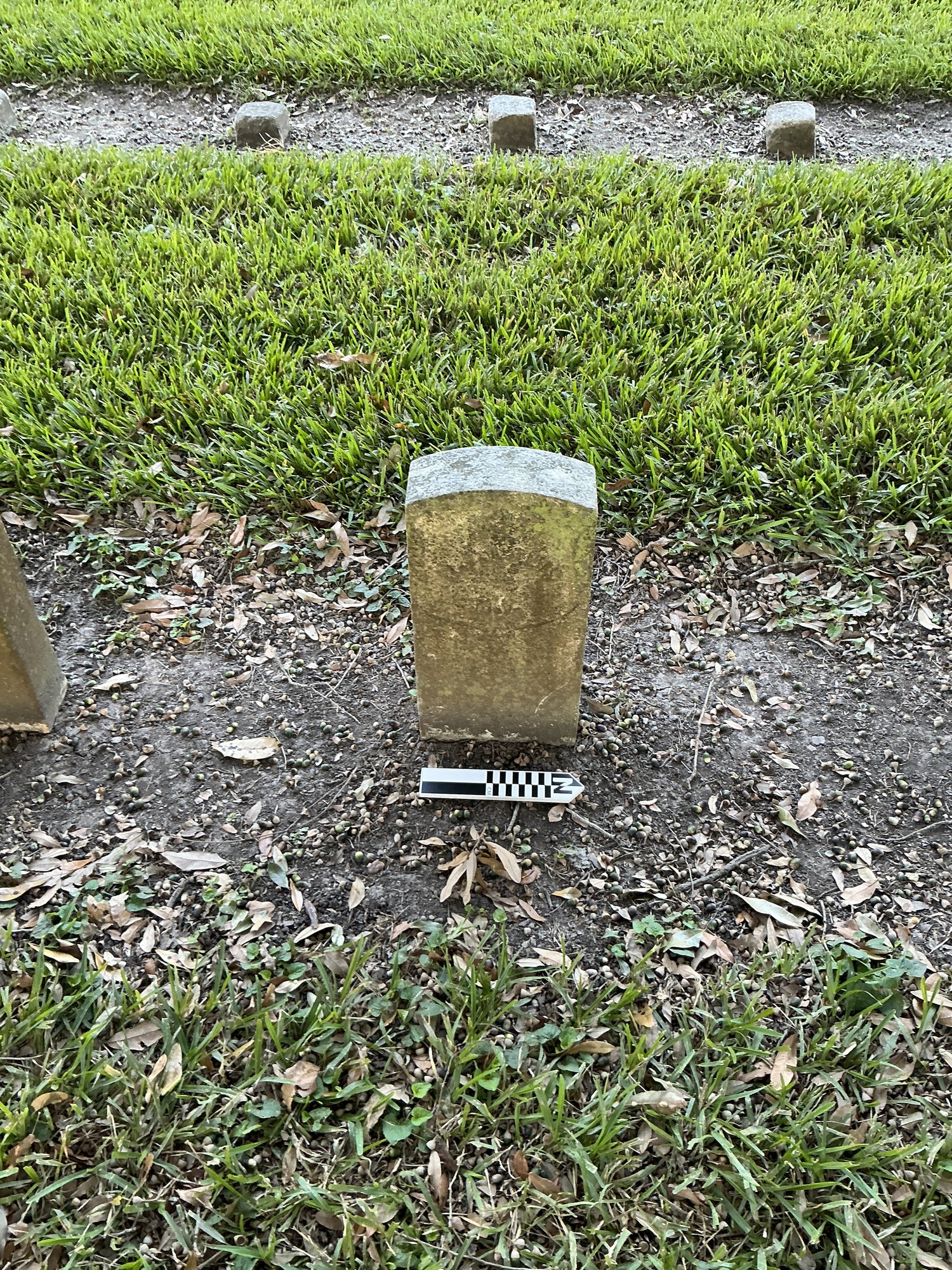 Extra image of historic upright marble headstone with recessed shield face.