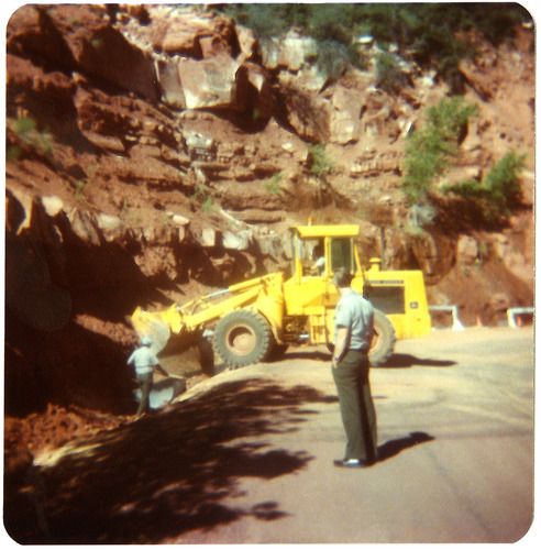 Tractor and men working on graveling/draining operations along the Zion-Mt. Carmel Highway switchbacks.
