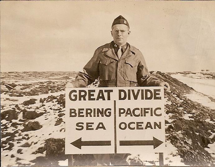 Clifford McGinnis and a sign illustrating the Bering Sea and Pacific Ocean