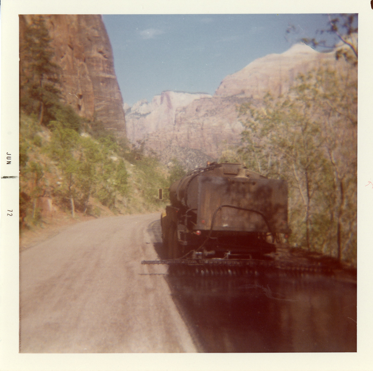 Construction vehicle chipsealing Zion roads.