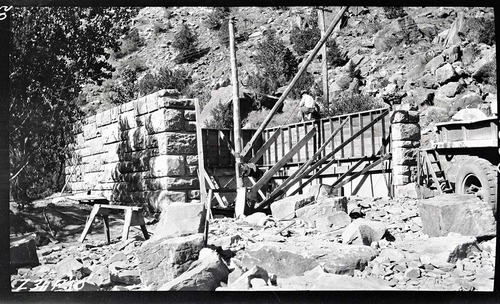 Garage and woodshed under construction. Note forms for concrete lining to save having to finish stone work inside of structure.