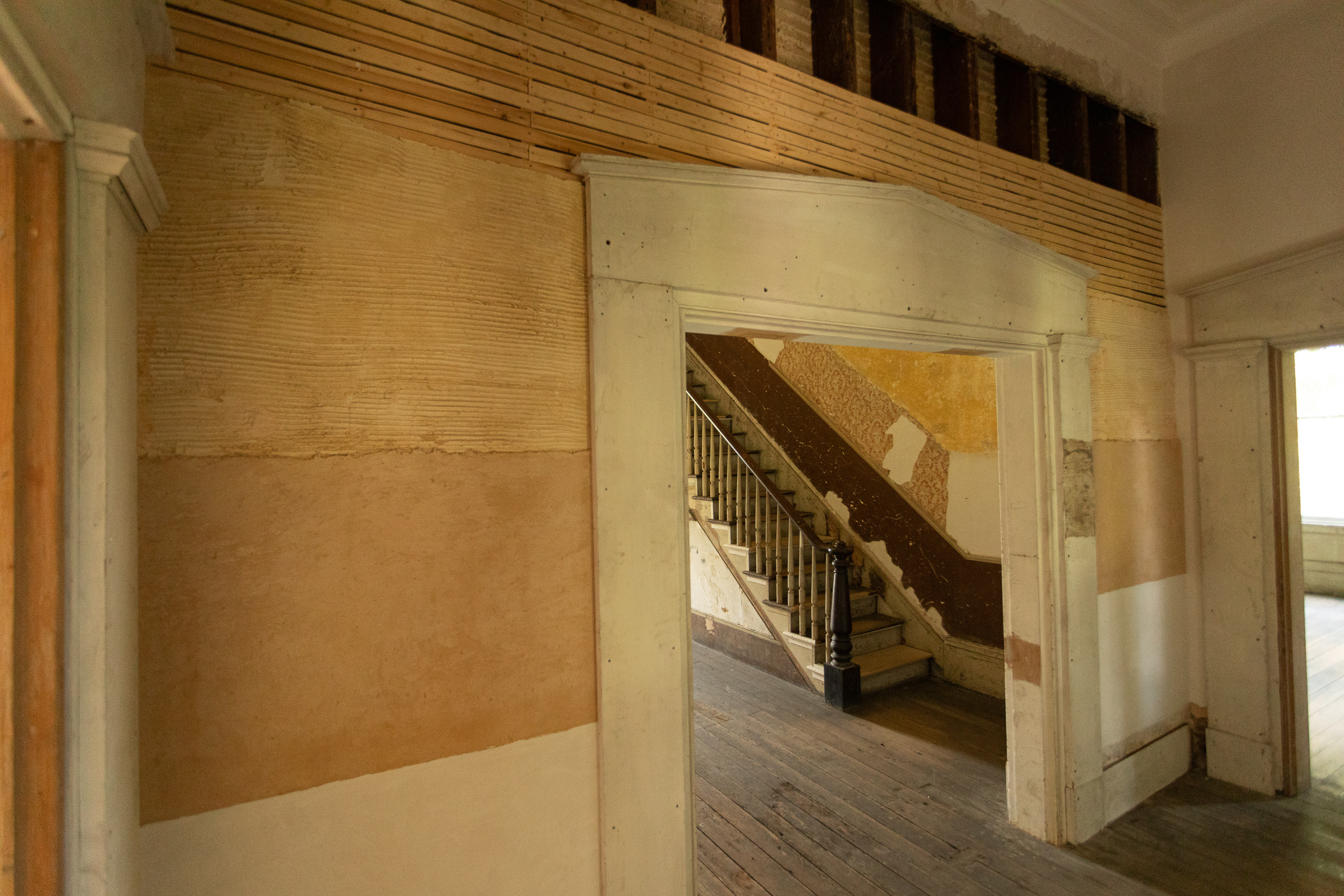 A small formal entrance area encloses the space at the front of the central hallway.  