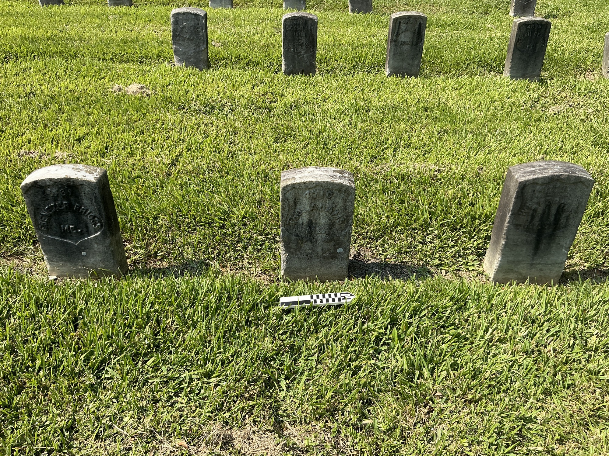 Extra image of historic upright marble headstone with recessed shield face.
