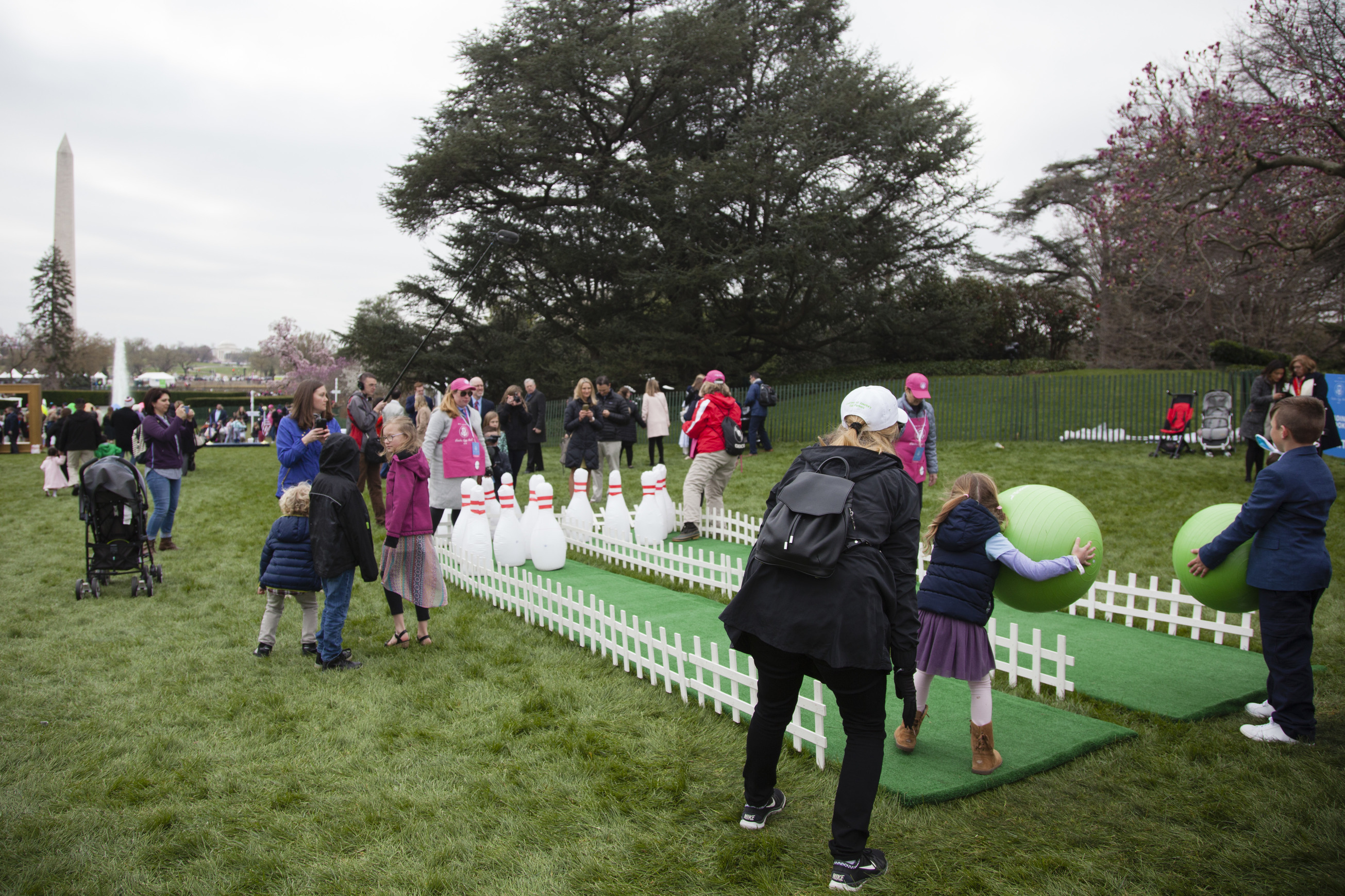 Children participate in a new Easter Egg Roll activity: bowling. 