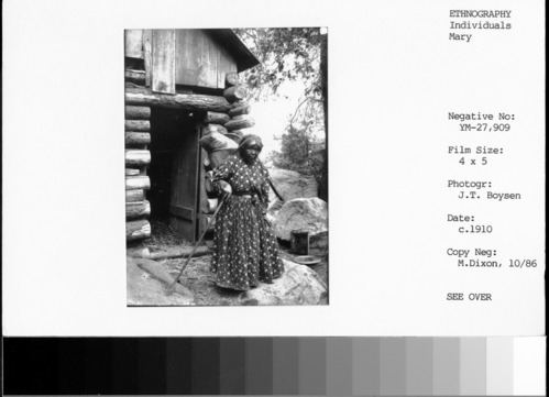 Copy Neg: M. Dixon, 10/86; Mary, with burden basket on her back & winnowing basket inside it. She probably made both. Use in Traditions and Innovations (p. 165, fig. 309).