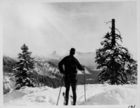 Holmes taking in a Ski-side View. Arthur G. Holmes Collection Album 5: Holmes skiing near Lake Helen