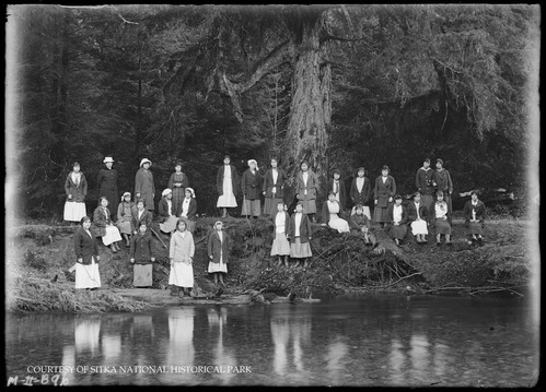 Uniform Corps members with two adult leaders.
