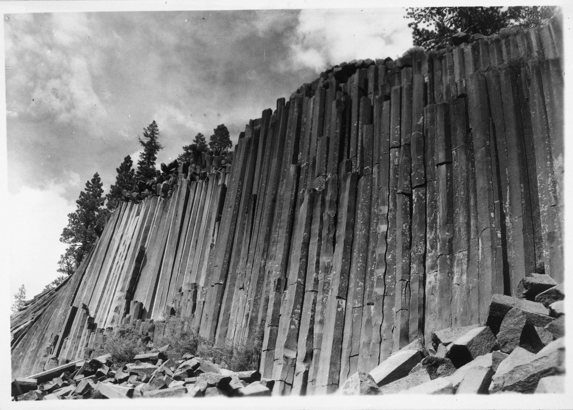 Palisades of Hexagonal Posts. Devils Postpile Nat. Monument. For geological views. Requested by Bryant on January 27, 1938. Photographed by Cather on January 28, 1938.