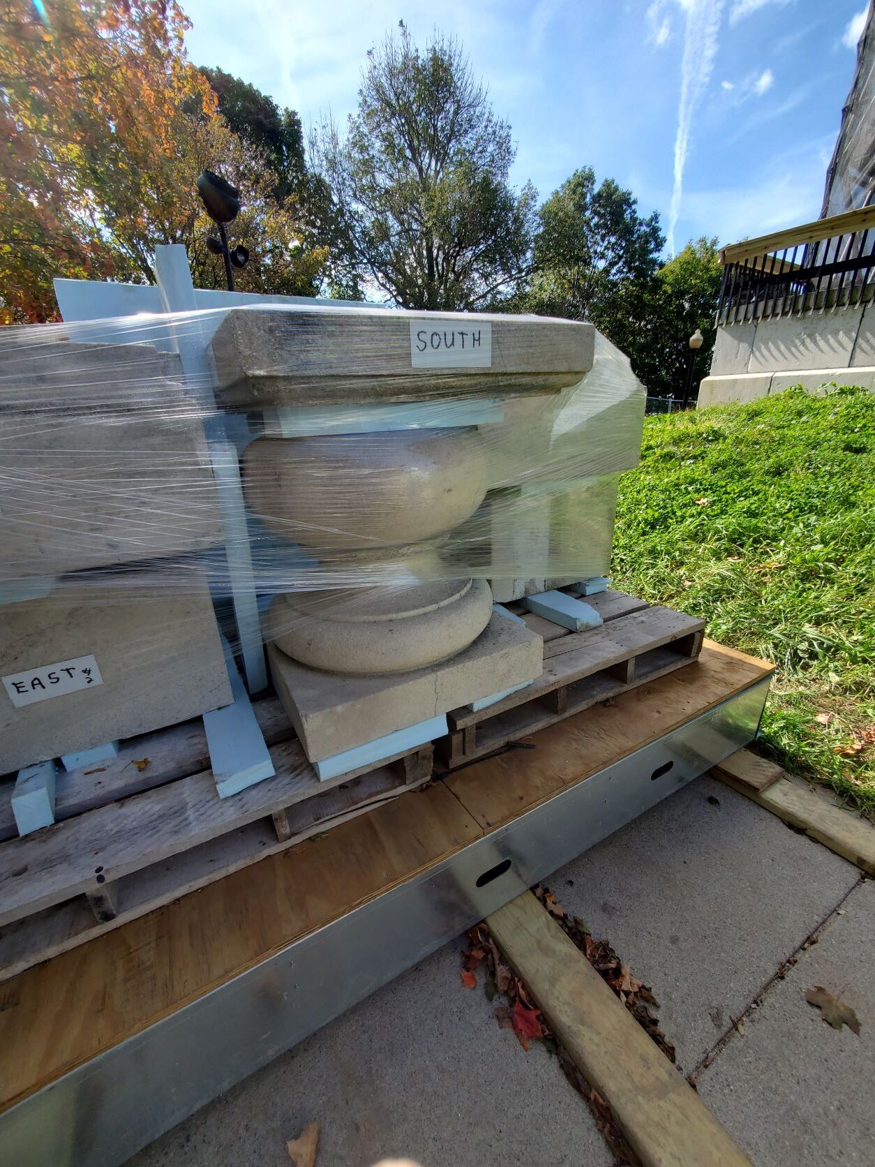 ornamental stones wrapped in plastic and sitting on a palette.