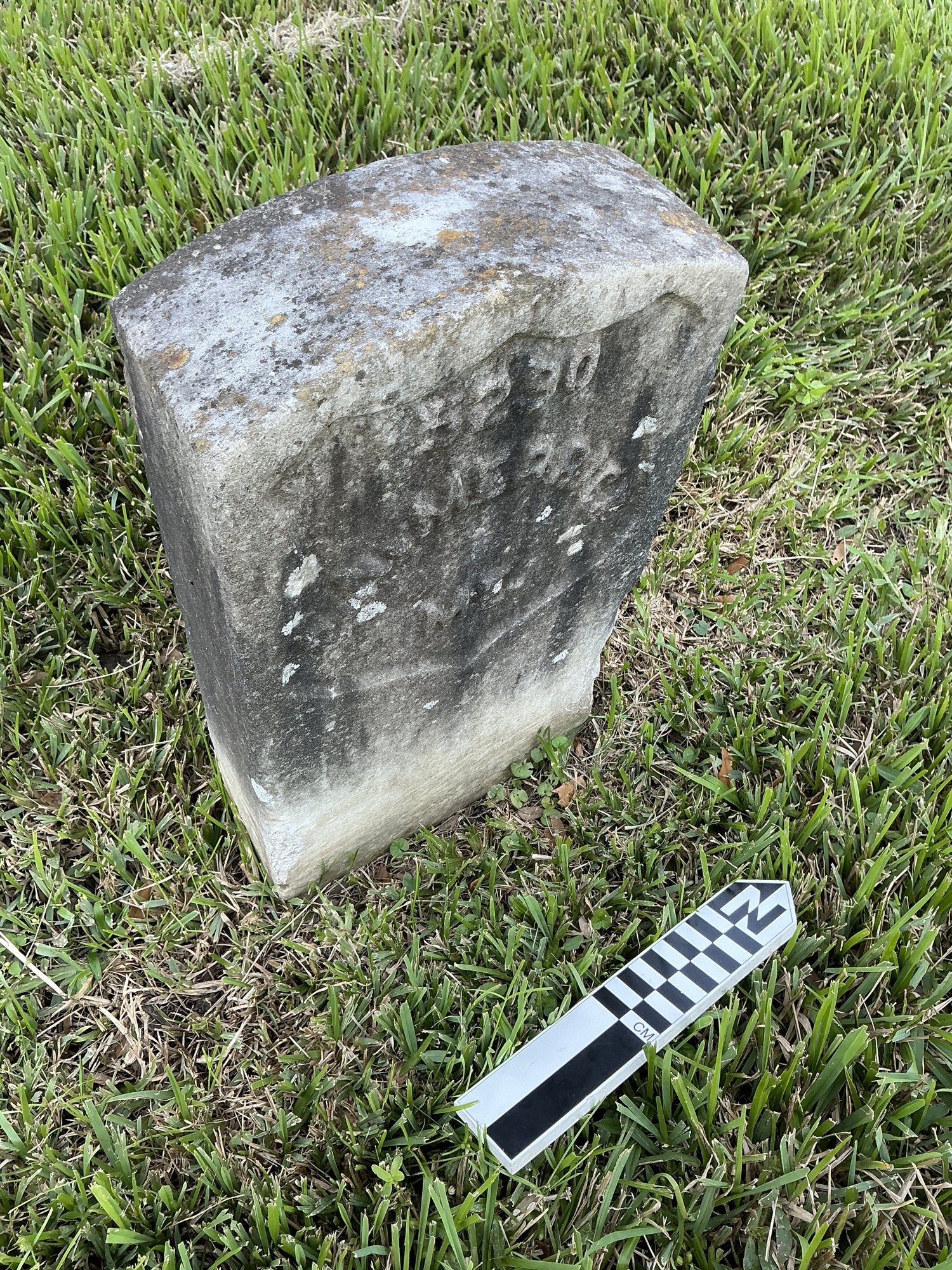 Extra image of historic upright marble headstone with recessed shield face.