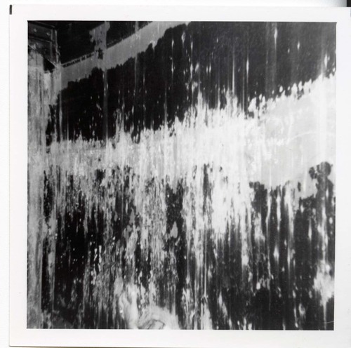 The interior of the 40000 gallon water tank showing buildup/corrosion.