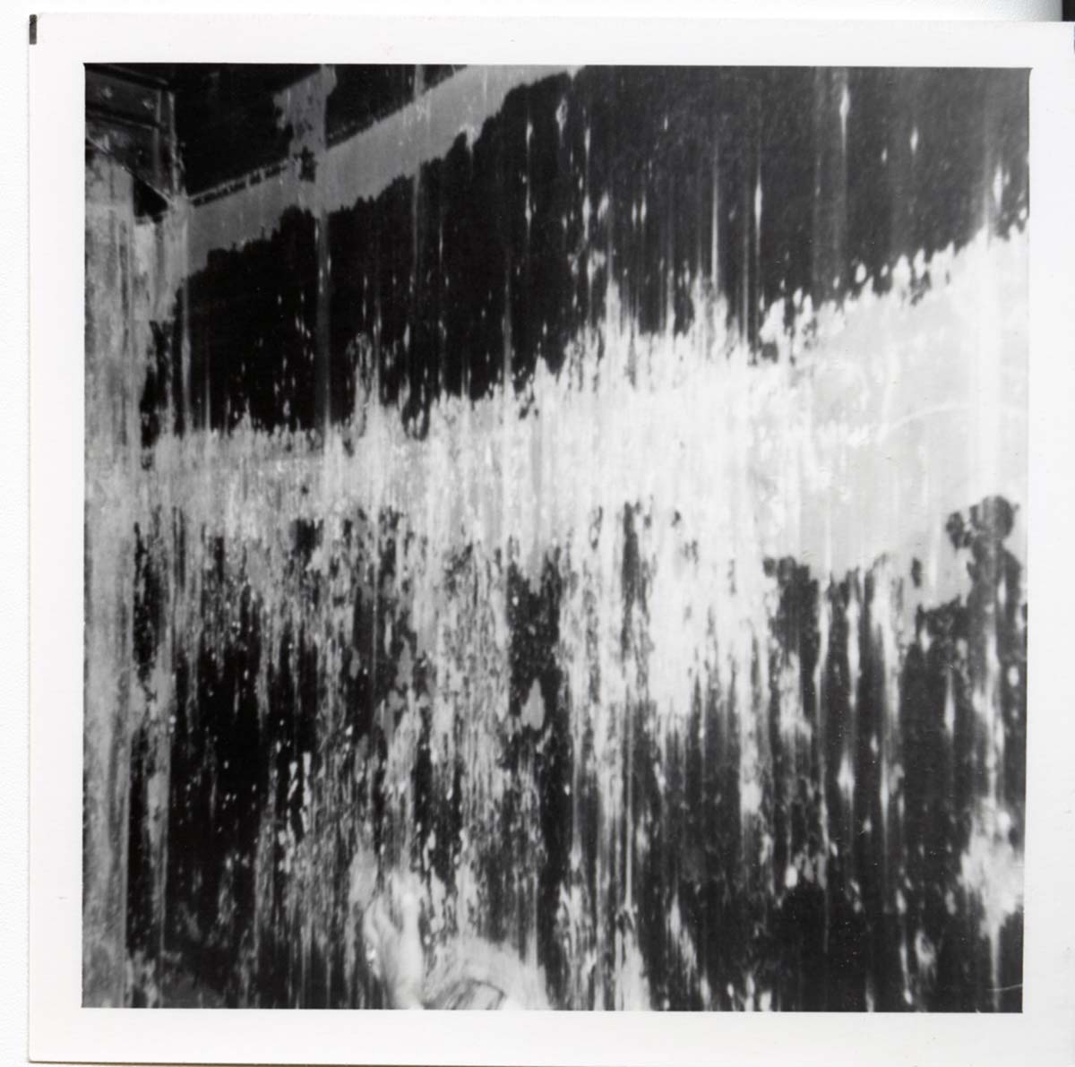 The interior of the 40000 gallon water tank showing buildup/corrosion.